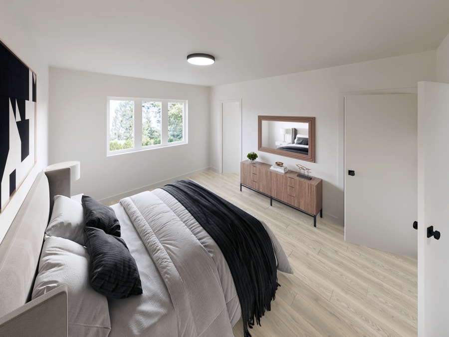 Bedroom with dresser and framed mirror